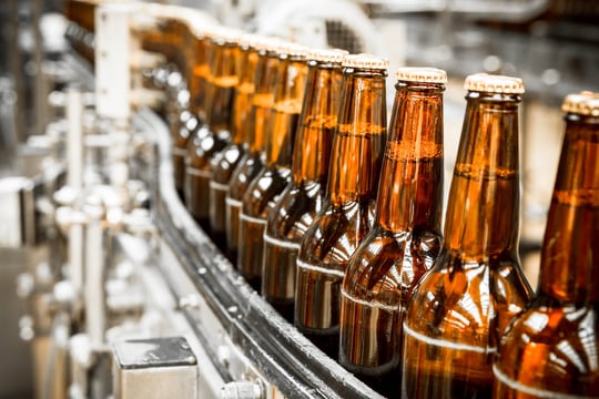 bottles on a production belt in a beverage plant