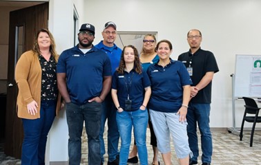 The Houston service team smiles for a group photo