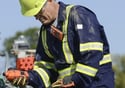 Picture of worker using two types of gas detection equipment to sample a space