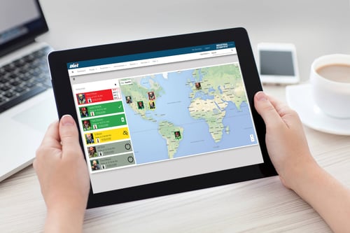 close shot of someone holding a tablet with a dashboard that shows industrial worker safety status and their location on a map