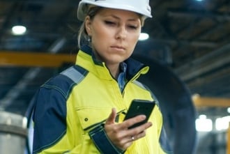 lone worker looking at cellphone