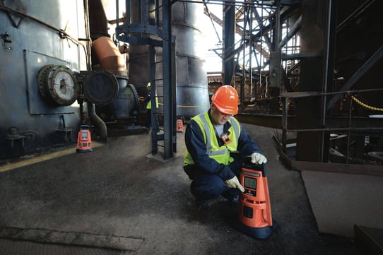 worker turning on area monitor