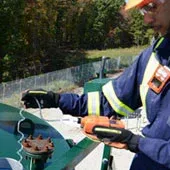 Picture of a worked using sampling tubing with a confined space monitor